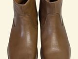 brown leather boots on a white background with a white background