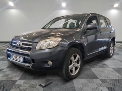 a picture of a gray toyota rav parked in a garage