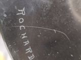 a close up of a metal object with writing on it