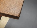 a close up view of a wooden table with a piece of wood sticking out of it