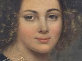portrait of a young woman in a black dress with a lace collar