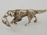 silver plated figurine of a dog with a bird in it ' s mouth