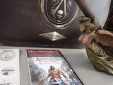 a statue of an angel holding a baseball bat next to a book and a clock