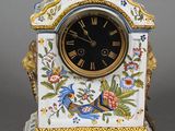 a clock that is sitting on a stand with a bird on it