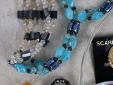 a lot of jewelry that is laying out on the table