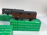 three model trains sitting on top of boxes on a table