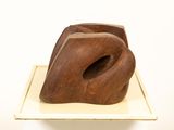 a wooden sculpture that is sitting on top of a table