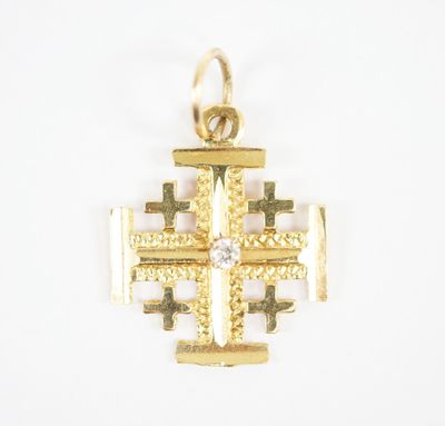 an image of a gold cross with a diamond in the center