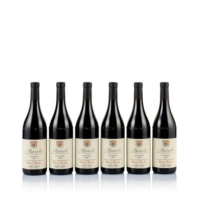 six bottles of wine are lined up on a white surface
