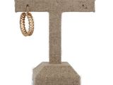 a close up of a ring on a stand on a white background