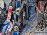a pile of tools sitting on the ground next to a wall