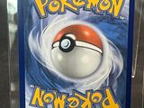the card is in a clear plastic case with a pokemon logo on it