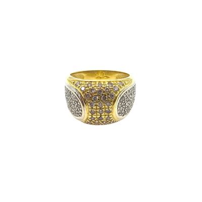 a close up of a gold ring with brown and white diamonds