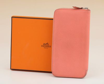 an orange and pink case with a box for a cell phone