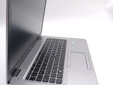 a close up of a laptop computer on a white surface