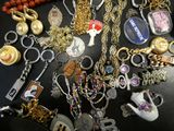 many different types of necklaces on a table
