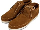 men ' s moccali slippers with fringes on top of them