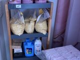 many bags of food on a shelf in a room