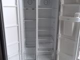 an open refrigerator that is sitting in a room