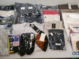 many different types of clothing on a table