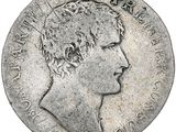 a close up of a coin with a man ' s face on it