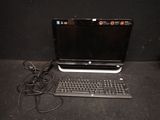 a laptop computer sitting on a table with a keyboard and mouse