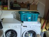 a washer and a dryer sitting on a kitchen counter