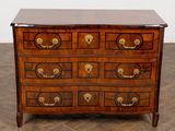 an image of a chest of drawers on a parquet floor