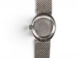 an image of a close up of a wrist watch on a white surface