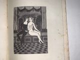 an old book with a picture of a woman sitting on a bench