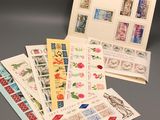a lot of different stamps and envelopes laid out on a table