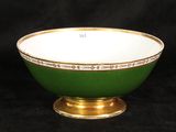 an image of a green and white bowl with gold trim