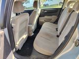 the interior of a car with the door open showing the front seats