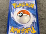 a close up of a dvd case with a pokemon ball on it