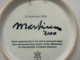a white plate with a picture of a man on it