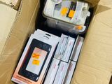 a cardboard box with a cell phone inside of it