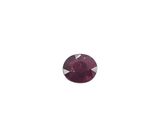 a close up of a red ruby stone on a white background