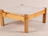 a small wooden table with a marble top on a white background