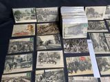 many old postcards on a table with a lot of them