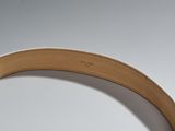 the belt is made of leather and has a metal buckle