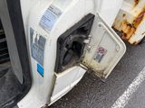 a gas pump on the side of a white truck