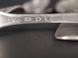 a close up of a spoon and a spoon rest on a table
