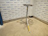 an image of a stand in a room with a sign on the wall