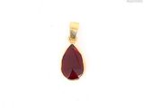 a close up of a red tear shaped pendant on a white background