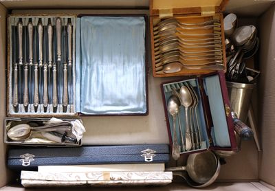 a box with a bunch of silverware in it