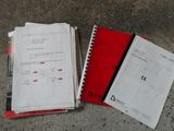 a lot of papers on the ground next to each other