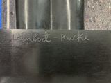 a close up of a metal object with writing on it