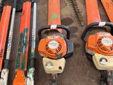 many different types of chainsaws on display in a garage