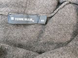 a close up of a label on the back of a sweater