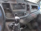 a car dashboard with a steering control and a phone holder